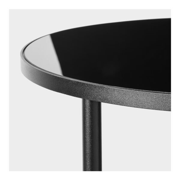 Close-up of modern black round side table