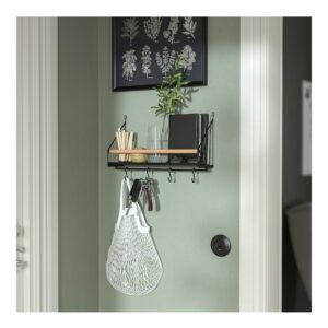 a wall mounted shelf with hooks and a basket