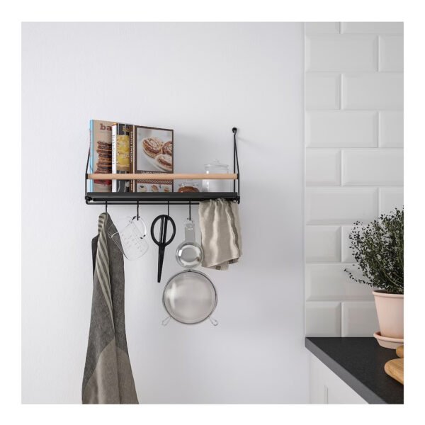 Modern kitchen wall shelf with utensils and plants.