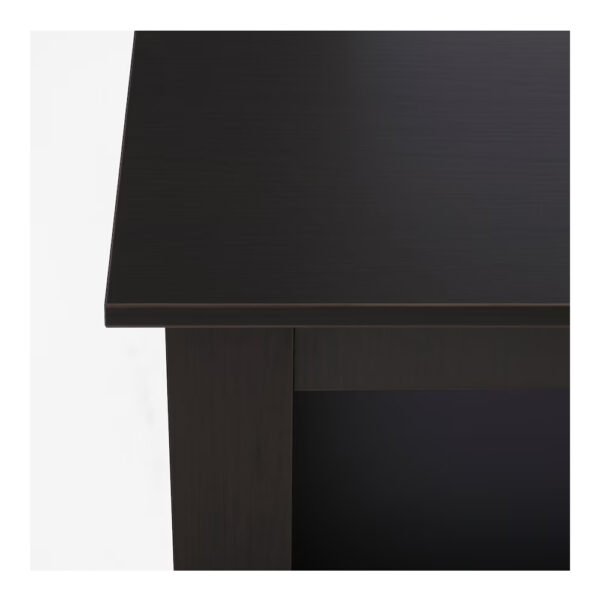 Close-up view of a modern black wooden desk.